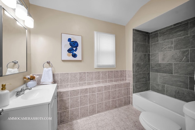 5029 W Superior St, Chicago, IL 60644 - bathroom with vanity, tile walls, tile patterned flooring, and vaulted ceiling