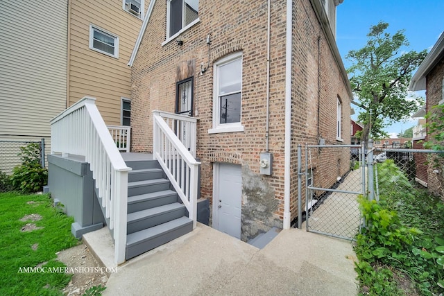 5029 W Superior St, Chicago, IL 60644 - view of property exterior featuring brick siding and a gate