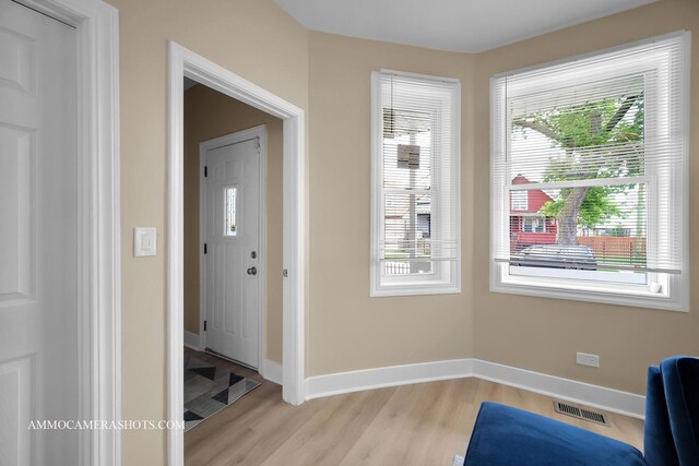 5029 W Superior St, Chicago, IL 60644 - foyer featuring light wood-type flooring and healthy amount of natural light