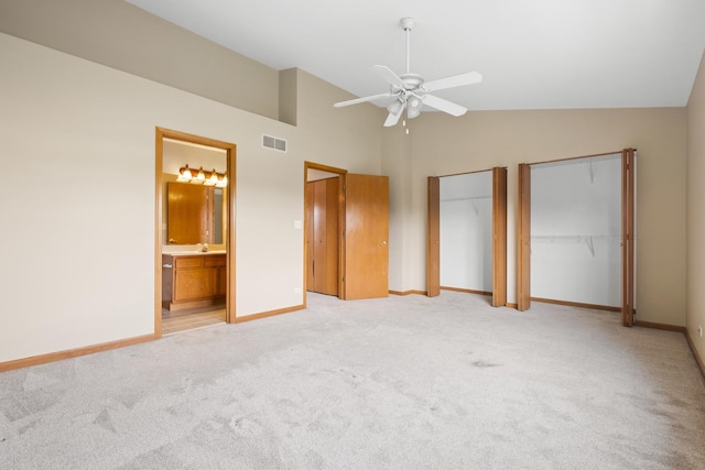 8004 Windsor Dr Unit 8004, Darien, IL 60561 - unfurnished bedroom with two closets, light carpet, ensuite bathroom, high vaulted ceiling, and ceiling fan