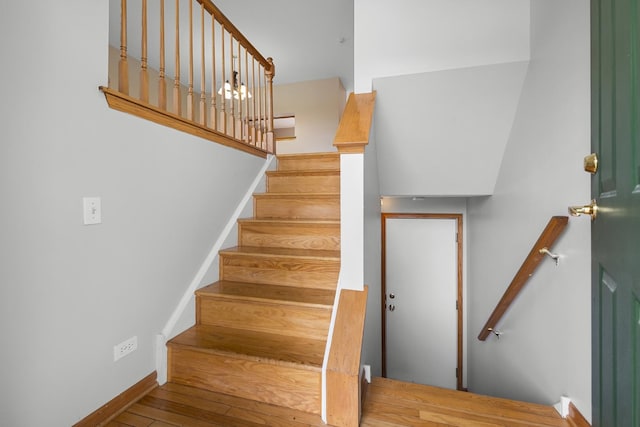 8004 Windsor Dr Unit 8004, Darien, IL 60561 - staircase featuring wood finished floors and baseboards