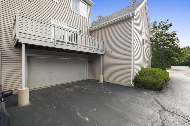 8004 Windsor Dr Unit 8004, Darien, IL 60561 - view of side of home featuring a balcony, driveway, and a garage