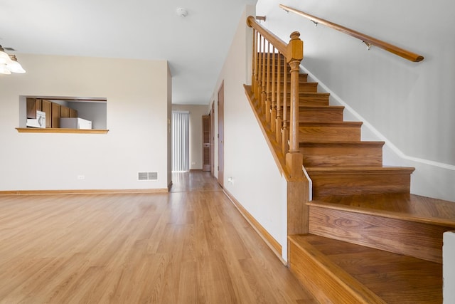 8004 Windsor Dr Unit 8004, Darien, IL 60561 - staircase with wood finished floors and baseboards