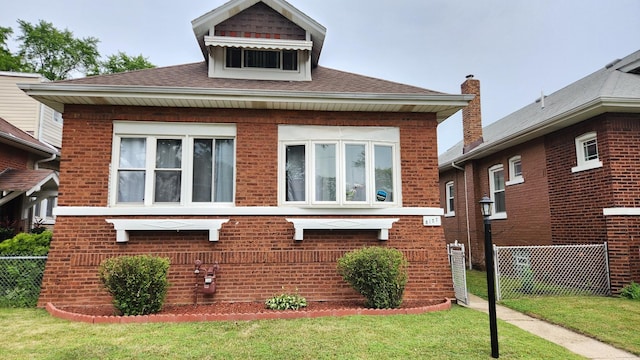 8127 S Blackstone Ave, Chicago, IL 60619 - view of front of property featuring brick siding and a shingled roof
