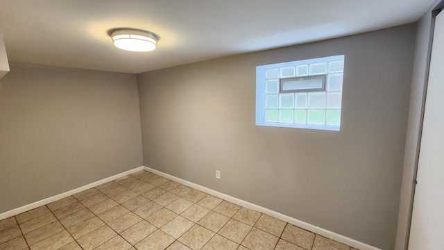 8127 S Blackstone Ave, Chicago, IL 60619 - spare room featuring baseboards and light tile patterned floors