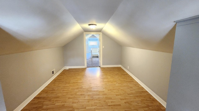8127 S Blackstone Ave, Chicago, IL 60619 - additional living space with light wood-type flooring and vaulted ceiling