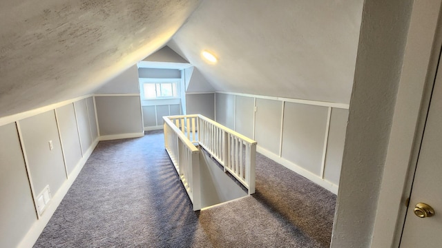 8127 S Blackstone Ave, Chicago, IL 60619 - bonus room featuring a decorative wall, carpet, vaulted ceiling, and wainscoting