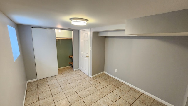 8127 S Blackstone Ave, Chicago, IL 60619 - unfurnished bedroom featuring baseboards and light tile patterned flooring