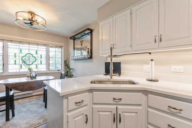 7930 W Lakeview Ct Unit 2A, Palos Heights, IL 60463 - kitchen featuring white cabinets, light countertops, and a chandelier