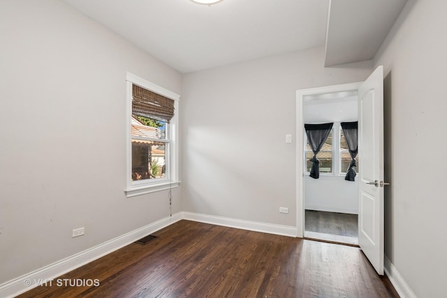 5155 W George St, Chicago, IL 60641 - unfurnished room featuring dark wood-type flooring and baseboards