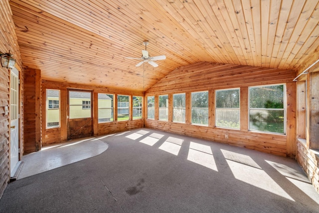 557 E Mckinley St, Hinckley, IL 60520 - unfurnished sunroom featuring lofted ceiling, a ceiling fan, wood walls, wooden ceiling, and carpet