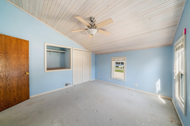 557 E Mckinley St, Hinckley, IL 60520 - unfurnished bedroom with lofted ceiling, wooden ceiling, carpet floors, a closet, and ceiling fan
