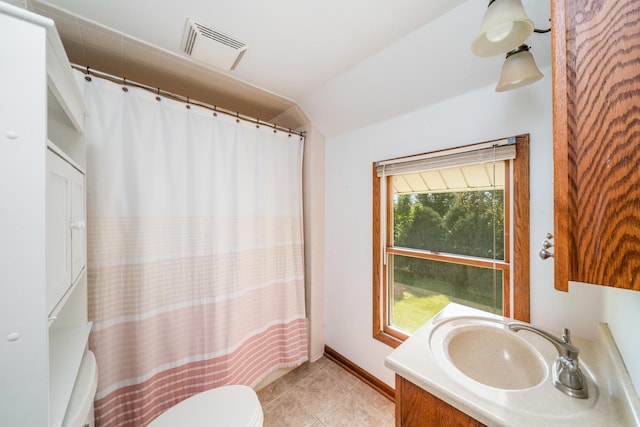 557 E Mckinley St, Hinckley, IL 60520 - bathroom with vaulted ceiling, vanity, tile patterned flooring, and a shower with curtain