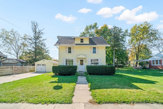557 E Mckinley St, Hinckley, IL 60520 - view of front facade with driveway, an outdoor structure, and a detached garage