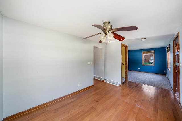 557 E Mckinley St, Hinckley, IL 60520 - spare room featuring light wood-type flooring and ceiling fan
