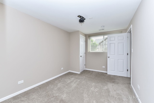 497 Le Moyne Ave, Romeoville, IL 60446 - unfurnished bedroom featuring carpet and baseboards