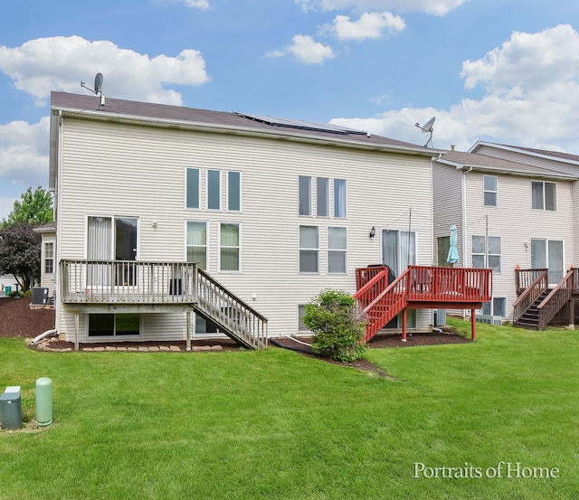 497 Le Moyne Ave, Romeoville, IL 60446 - rear view of house featuring stairway, a wooden deck, and a lawn