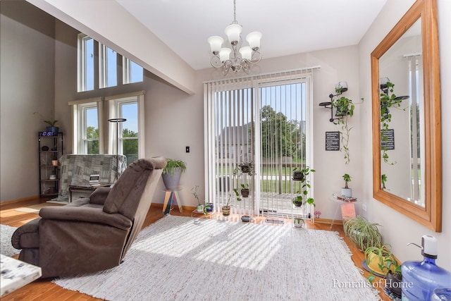 497 Le Moyne Ave, Romeoville, IL 60446 - sitting room with plenty of natural light, a chandelier, and wood finished floors