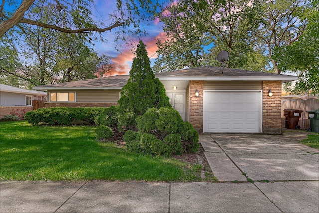 431 Lakewood Blvd, Park Forest, IL 60466 - ranch-style home with brick siding, a front yard, concrete driveway, and an attached garage