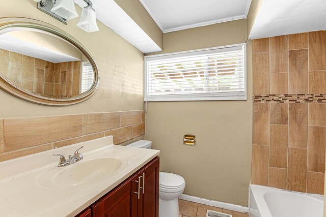 431 Lakewood Blvd, Park Forest, IL 60466 - bathroom featuring vanity, crown molding, tile patterned flooring, and washtub / shower combination