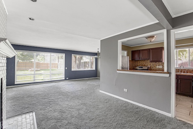 431 Lakewood Blvd, Park Forest, IL 60466 - unfurnished living room with a fireplace, carpet, and crown molding