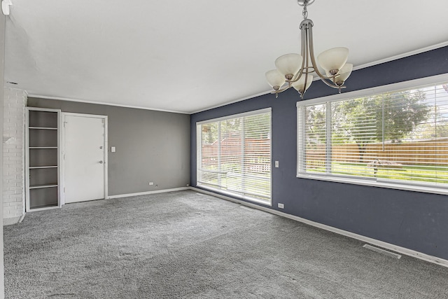 431 Lakewood Blvd, Park Forest, IL 60466 - carpeted spare room featuring a chandelier and crown molding