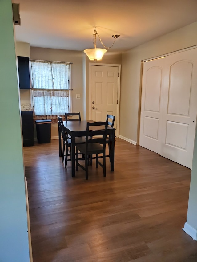 4917 Prairie Ave, Mchenry, IL 60050 - dining area with baseboards and dark wood-style flooring