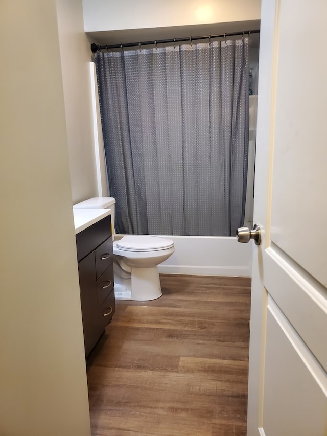 4917 Prairie Ave, Mchenry, IL 60050 - bathroom with vanity, wood finished floors, and shower / bathtub combination with curtain