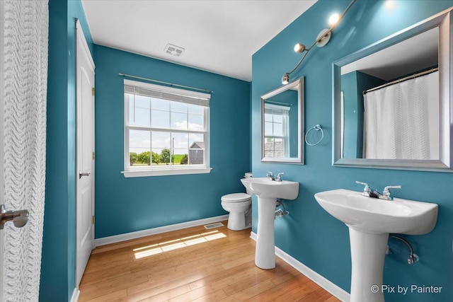 911 Water Stone Way, Malta, IL 60150 - bathroom with baseboards and wood finished floors