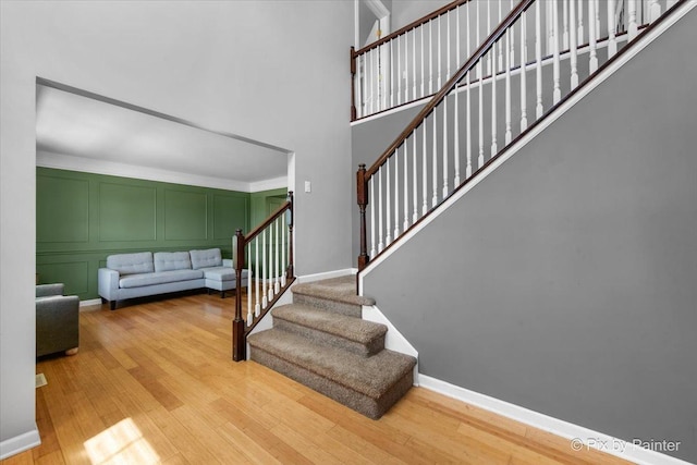 911 Water Stone Way, Malta, IL 60150 - staircase with wood finished floors and a towering ceiling