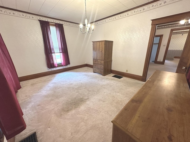 506 E Lincoln St, Saybrook, IL 61770 - spare room with a chandelier, carpet flooring, and ornamental molding