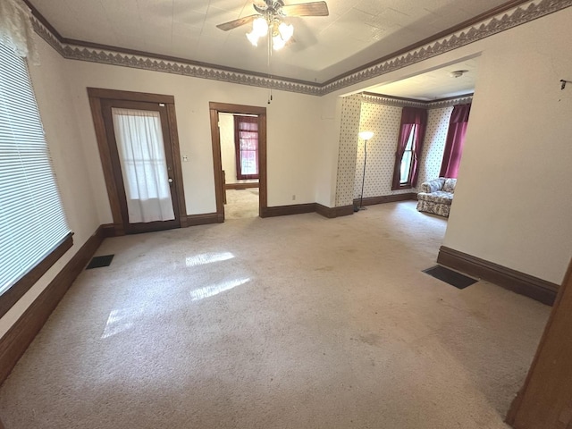 506 E Lincoln St, Saybrook, IL 61770 - unfurnished room with light carpet, ceiling fan, and ornamental molding