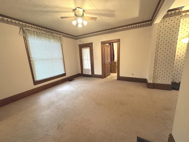 506 E Lincoln St, Saybrook, IL 61770 - unfurnished room featuring light carpet, crown molding, and a ceiling fan
