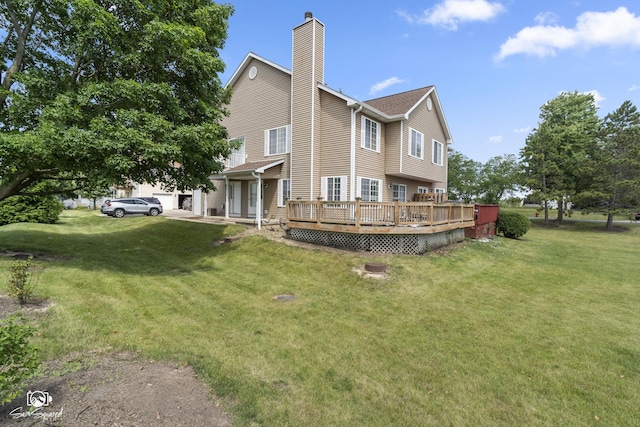 1644 Bridle Post Dr Unit 1644, Aurora, IL 60506 - rear view of property featuring a chimney, a deck, and a yard