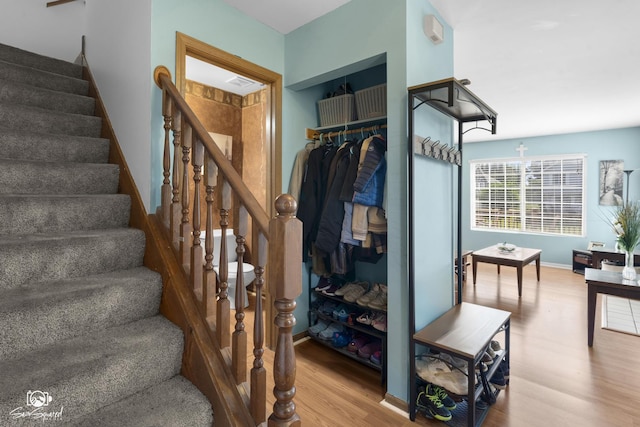 1644 Bridle Post Dr Unit 1644, Aurora, IL 60506 - staircase featuring wood finished floors and baseboards