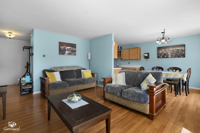 1644 Bridle Post Dr Unit 1644, Aurora, IL 60506 - living room featuring a chandelier and light wood-style floors