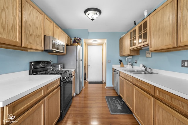 1644 Bridle Post Dr Unit 1644, Aurora, IL 60506 - kitchen featuring stainless steel appliances, light countertops, wood finished floors, and glass insert cabinets