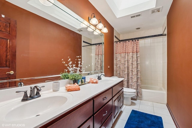 9228 S 55th Ct, Oak Lawn, IL 60453 - full bath with double vanity, tile patterned flooring, a skylight, and shower / tub combo