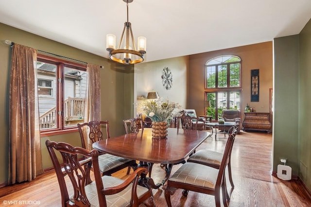 9228 S 55th Ct, Oak Lawn, IL 60453 - dining space with light wood-style flooring and a chandelier