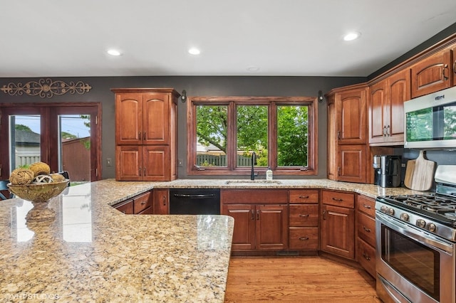 9228 S 55th Ct, Oak Lawn, IL 60453 - kitchen with appliances with stainless steel finishes, light stone counters, recessed lighting, light wood-type flooring, and brown cabinetry