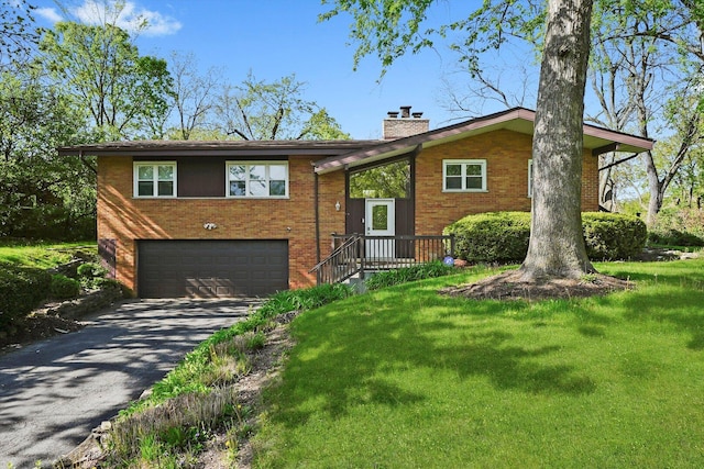 2747 Perry Rd, Flossmoor, IL 60422 - view of front of home with an attached garage, driveway, a chimney, and brick siding