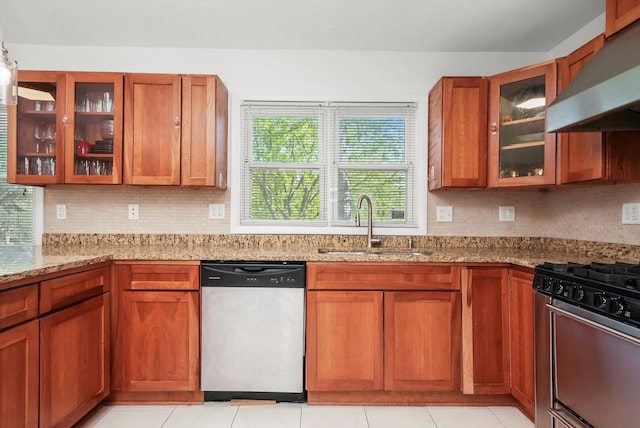 2747 Perry Rd, Flossmoor, IL 60422 - kitchen featuring appliances with stainless steel finishes, wall chimney exhaust hood, decorative backsplash, brown cabinets, and light stone countertops