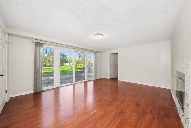 2747 Perry Rd, Flossmoor, IL 60422 - unfurnished living room with wood finished floors and a glass covered fireplace