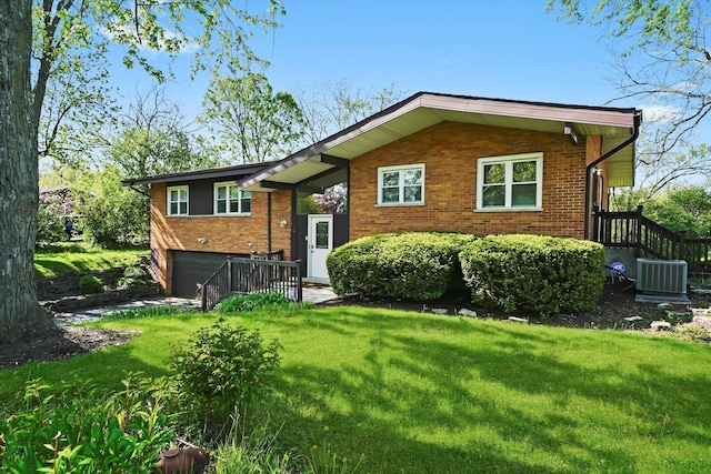 2747 Perry Rd, Flossmoor, IL 60422 - view of front facade with a front yard, brick siding, and a garage