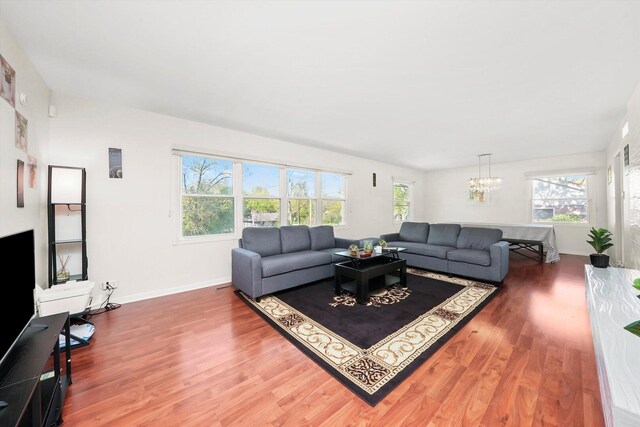 2747 Perry Rd, Flossmoor, IL 60422 - living room with wood finished floors and a chandelier