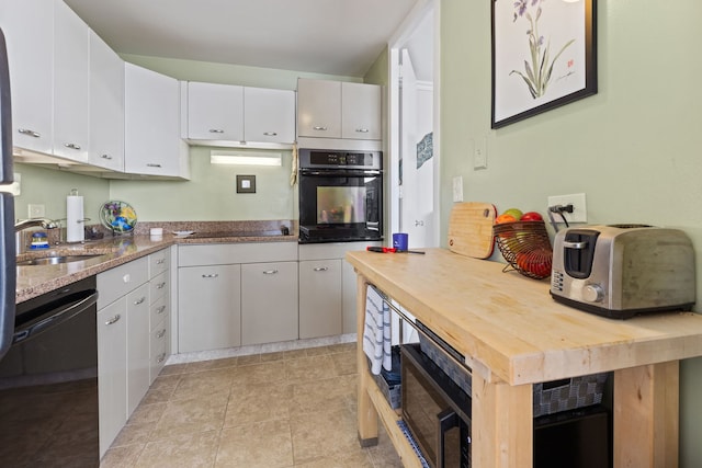 4800 S Chicago Beach Dr Unit 513N, Chicago, IL 60615 - kitchen with black appliances, wood counters, and white cabinets
