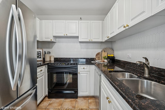 3660 N Lake Shore Dr Unit 4502, Chicago, IL 60613 - kitchen with appliances with stainless steel finishes, white cabinetry, dark stone countertops, and light tile patterned floors