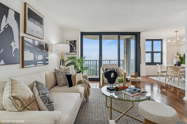 3660 N Lake Shore Dr Unit 4502, Chicago, IL 60613 - living room featuring a chandelier, wood finished floors, and a textured ceiling