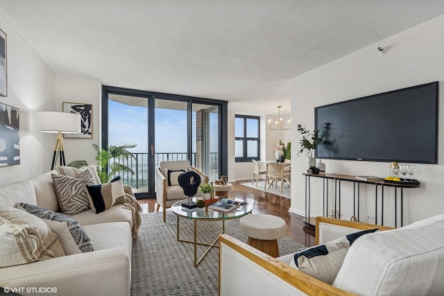 3660 N Lake Shore Dr Unit 4502, Chicago, IL 60613 - living room featuring a chandelier, a textured ceiling, and wood finished floors