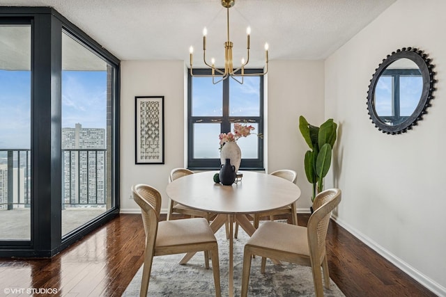 3660 N Lake Shore Dr Unit 4502, Chicago, IL 60613 - dining area with a wall of windows, a chandelier, dark wood-style floors, and a textured ceiling